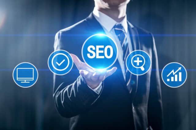 man holding out his hand with an SEO bubble in front of him thinking about how he can keep from hurting seo